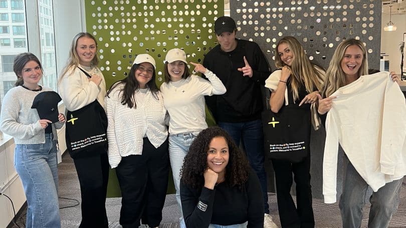 A group of TravelPerk employees pose together.