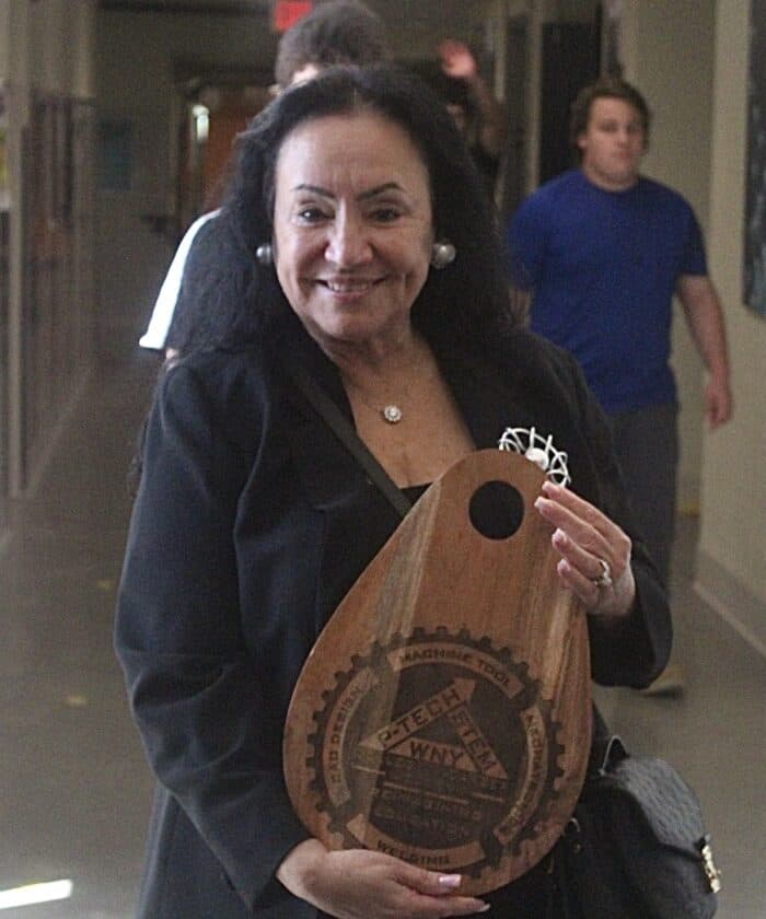 Dr. Betty Rosa, Commissioner of the New York State Department of Education, proudly displays a custom charcuterie board gifted to her by WNY P-TECH students earlier this week.
