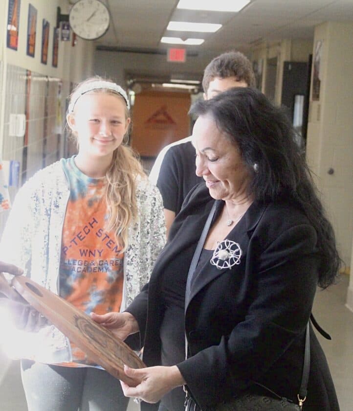 State Education Department Commissioner Dr. Betty Rosa listens to students describe their experiences at WNY P-TECH in Dunkirk while having lunch at the campus.